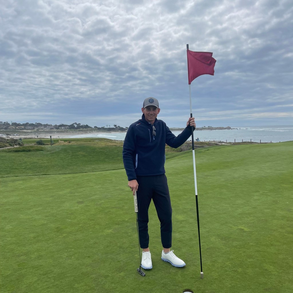 Dale Prater Golf Instructor on golf course with flag near hole